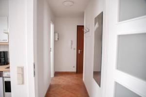 a hallway with a door leading to a kitchen at Lagunenstadt am Haff - 80 Kai in Ueckermünde