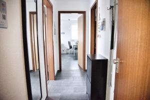 a hallway with a mirror and a hallway with a hallway at Lagunenstadt am Haff - Fewo 34 Palstek in Ueckermünde +11 photos