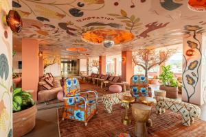a room with a ceiling with fish painted on it at NYX Hotel Ibiza by Leonardo Hotels-Adults Only in San Antonio Bay