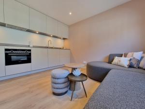 a living room with a couch and a table at LÖYLY Egmond in Egmond aan Zee