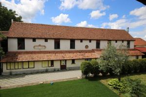 a large white building with a red roof at Transylvanian Nest in Cristian