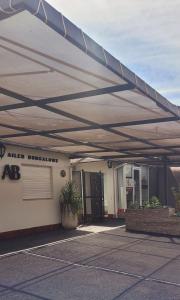 awning over a parking lot in front of a building at Bungalows Ailen in Federación