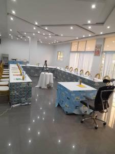 a large room with two tables and chairs in it at Hôtel Copacabana Kribi in Kribi +44 photos