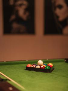 a billiard triangle with balls on a pool table at Hotel Borowiecki in Łódź +97 photos