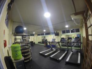 a gym with rows of treadmills in a room at Hotel em Barreirinhas in Barreirinhas