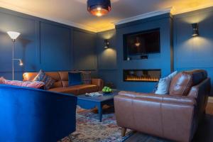 a living room with a couch and a table at Keons Town House in Longford