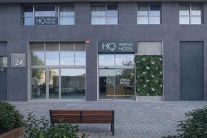 a building with a bench in front of it at HQ Arena Hotel in Valencia