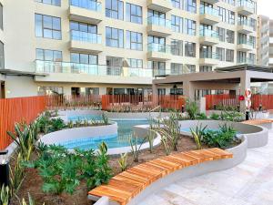 a swimming pool in front of a building at Reserva del Mar II 821 in Gaira