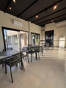 a group of tables and chairs in a building at Asunción Airport in Asunción
