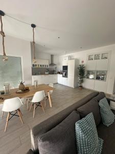 a living room with a couch and a table at DuMar Beachouse in Salema