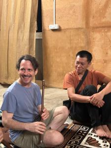 two men are sitting on the floor with swords at Zomad Hostels Pondicherry, Auroville Road in Auroville +44 photos