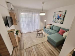 a living room with a couch and a table at Triumph 1 - A in Paralimni