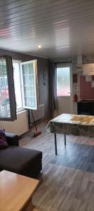 a living room with a bed and a couch at Chez NONO in Ruffec