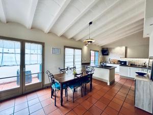 a kitchen with a table and chairs in a room at I Love Perpignan Duplex Terrasse in Perpignan