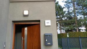 a building with a door and a mailbox next to it at Apartamenty Rudzka in Rybnik