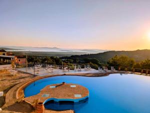 a view of a pool at a resort at Anima Rooms&Pool - Affittacamere con piscina in San Pasquale