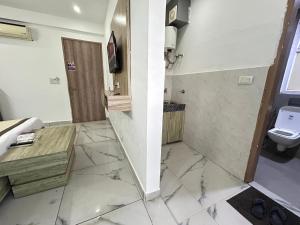 a bathroom with a sink and a toilet at Hotel Akshay dream stay in Gurgaon +60 photos