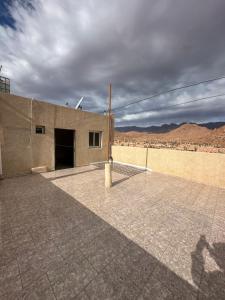 a building with a pole on the side of it at Apparemment tafoukt in Tafraout +1 photo