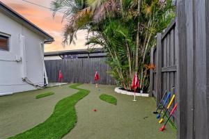 a yard with miniature golf equipment on the grass at Hollywood 4BR Home with Private Heated Pool in Hollywood
