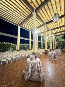 a pavilion with a table and chairs in it at Hotel Castillo de Montemayor in Montemayor