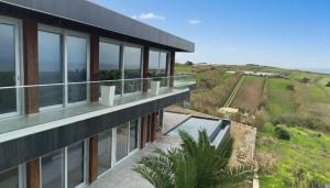 an aerial view of a house with a balcony at Mycelio Atlantic Residence with Atlantic View in Ribamar