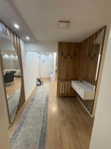 an empty room with a desk and a mirror at Stan na dan Jelah in Jelah +3 photos