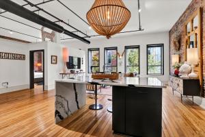 an open kitchen and living room with a large island at Luxe 220 Suite 2 in Wilmington