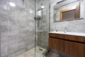 a bathroom with a sink and a shower at Magnificent apartment 10 in Casablanca +30 photos