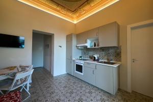 a kitchen with a sink and a counter top at Artop in Messina