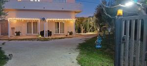 a house with christmas lights on the front of it at La Fattoria dei Desideri in Ripa Teatina