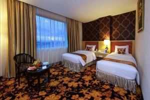 Ett rum på Rocky Plaza Hotel Padang