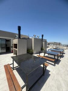 a group of picnic tables on a patio at Brickell 3A in Tigre