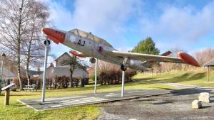 a small plane is on display in a park at Monsieur Morgan's in Féniers