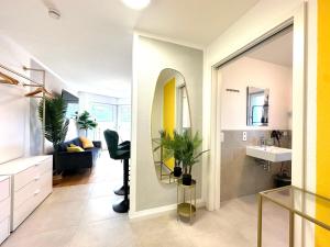 a bathroom with a sink and a mirror at YAYstay - comfy Lofts in Rosenheim in Rosenheim