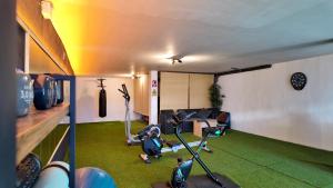 a living room with a room with green grass at Casa Maldivas - Cerca playa de Barro/ Niembro in Posada de Llanes