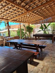 a picnic table on a patio with a ping pong ball at Sitio Cantinho da Alegria in Confins