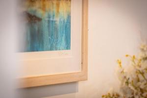a picture on a wall with a painting on it at Downshire Haven in Holywood