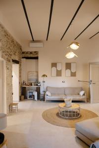 a living room with a couch and a table at B&B Il Belvedere 2 in Guardialfiera +35 photos