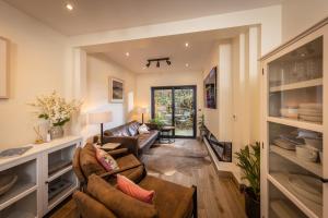 a living room with a couch and a table at Downshire Haven in Holywood