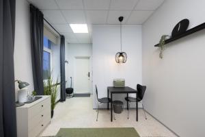 an office with a table and chairs in a room at loond Stay- Kehra Ärimaja in Kekra