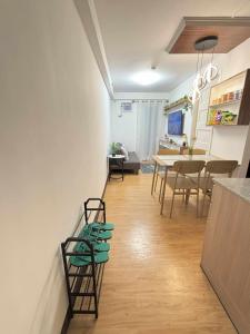 a kitchen and dining room with a table and chairs at Arezzo Place Davao in Davao City