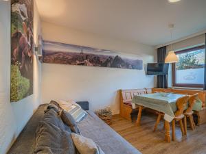 a living room with a bed and a table at Hohe Tauern in Mittersill