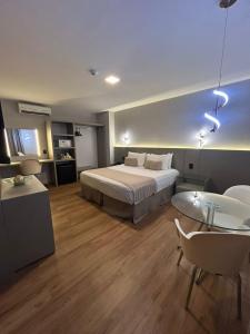 a hotel room with a bed and a table at Hotel Maysa Caruaru in Caruaru +35 photos