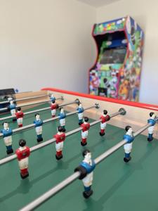 a group of toy figures playing a game of bowling at Gîte Le Fortin in Ucel