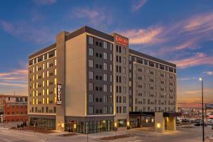 a hotel building with a sign on top of it at Drury Plaza Hotel Lincoln Downtown in Lincoln