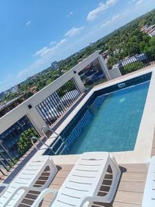 a swimming pool on the roof of a building at Asunción Airport in Asunción