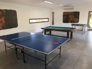 a room with two ping pong tables in it at La Posada de África in Mar del Plata