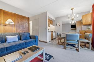 a living room with a couch and a dining room at Lift House Lodge, Vail Lionshead Studio Condo, Walk to Gondola in Vail