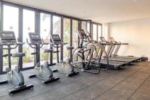 a gym with rows of exercise bikes and ellipticals at Kombo Beach Resort in Serekunda