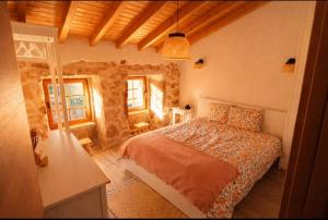 a bedroom with a large bed in a room at Casa Martinho & Neves in Seia